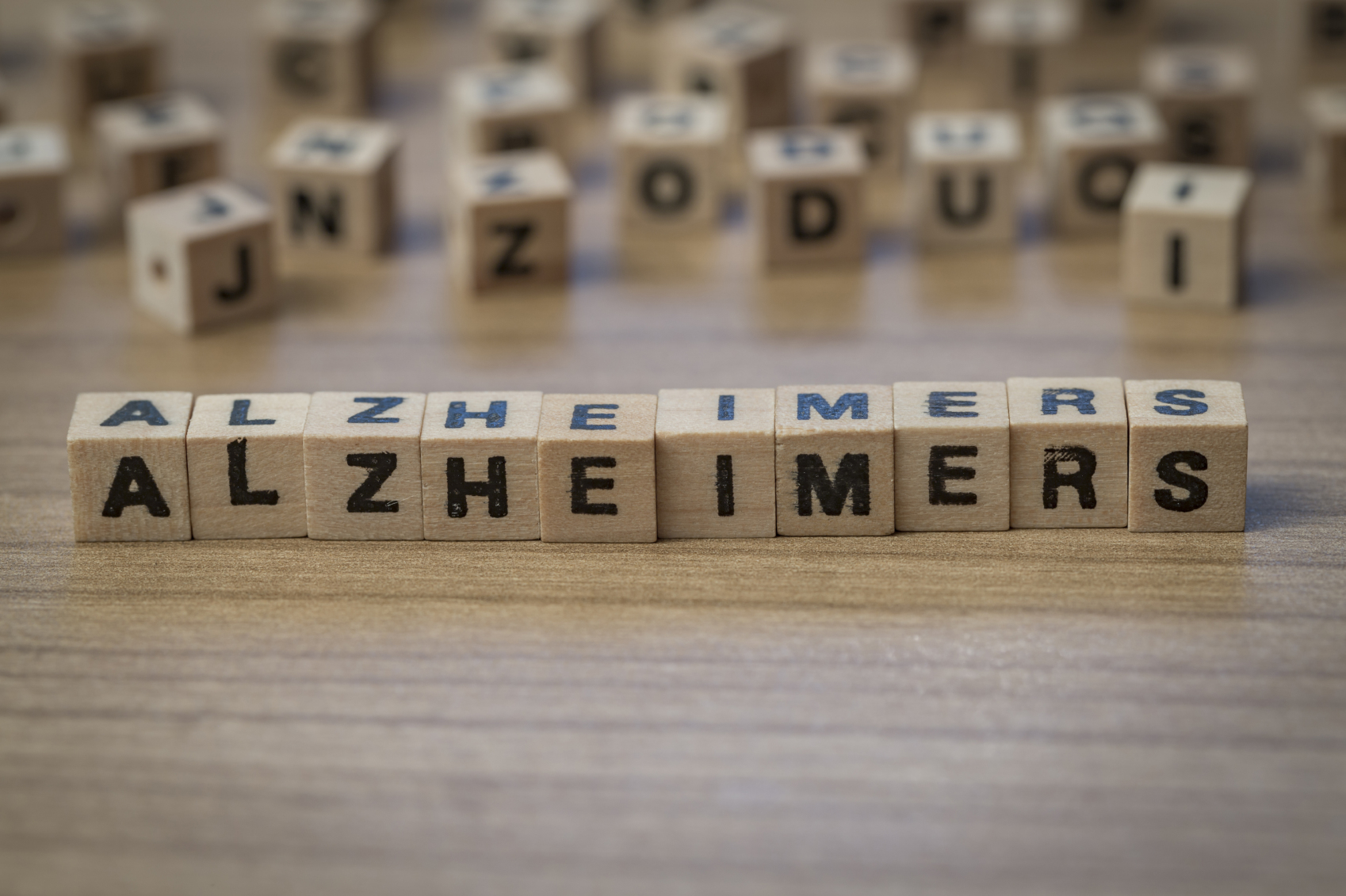 Alzheimers written in wooden cubes early warning signs of alzheimer's disease