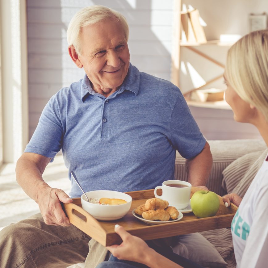 An Alzheimer's patient in Queens with a caregiver.