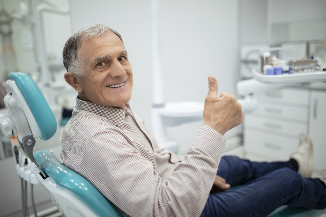 Senior Man at the Dentist Happy senior man who is free of periodontal disease in New York City.
