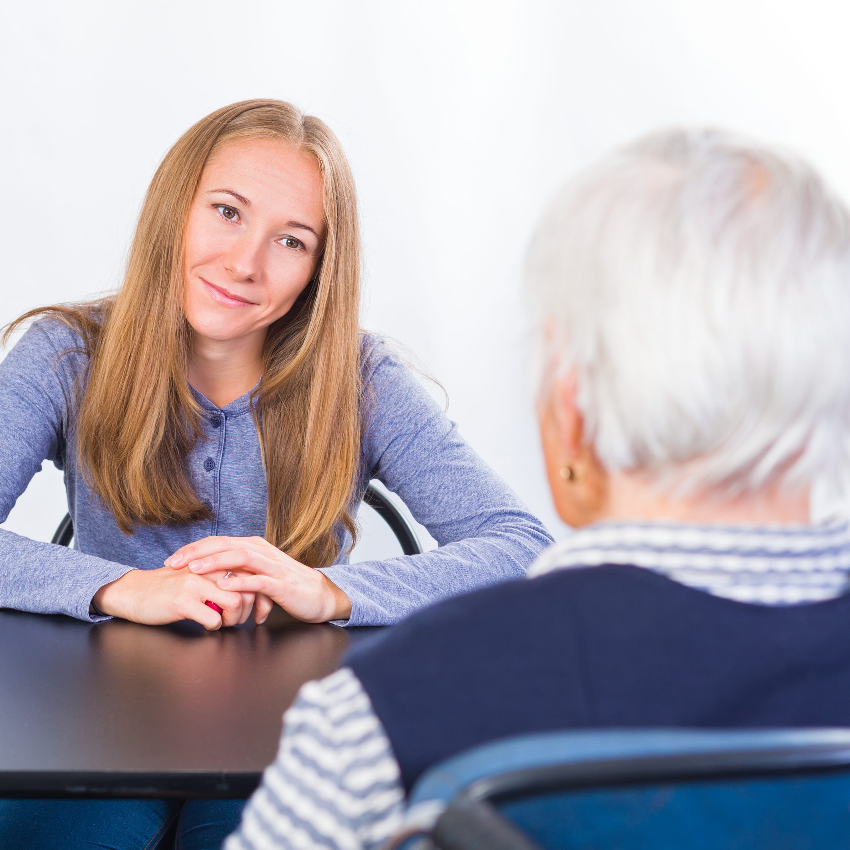 Elderly woman with the therapist geriatric care manager