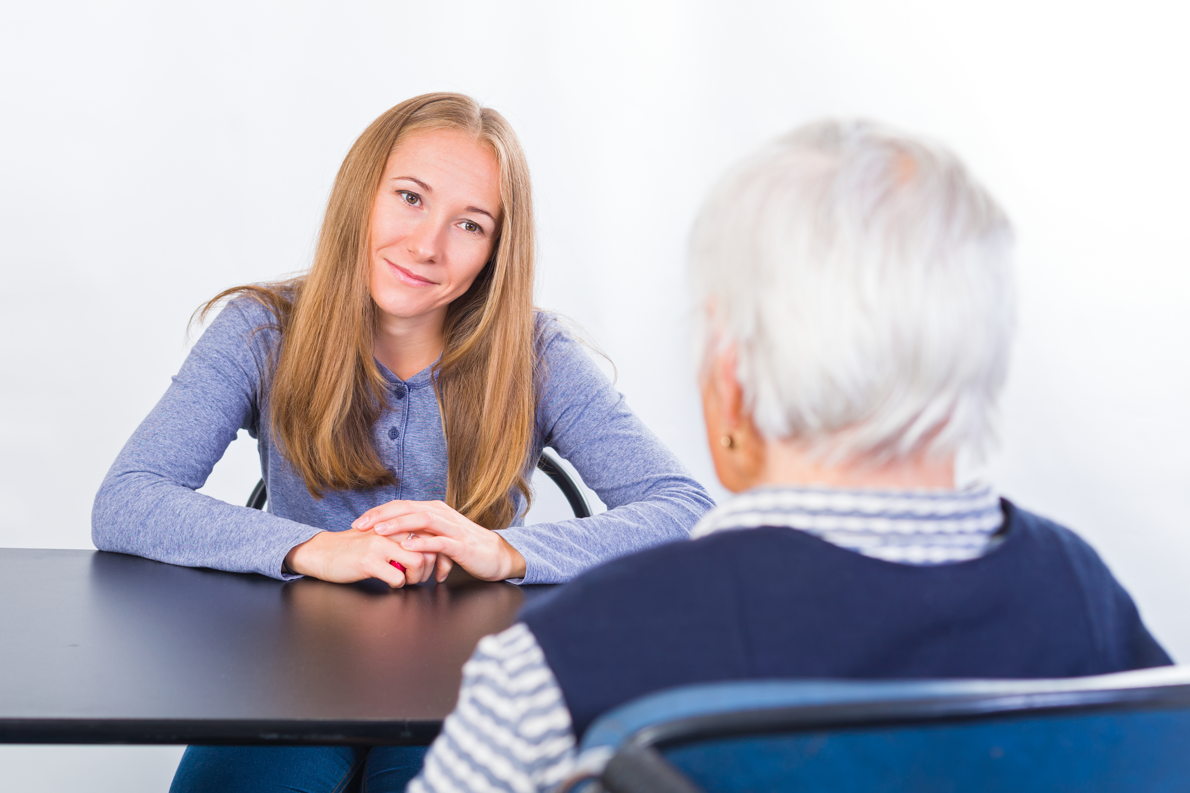 Elderly woman with the therapist geriatric care manager