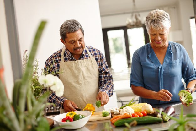 A Senior Couple Cooking a Healthy Meal Together in Bayside Senior weight loss diets in Bayside; a senior couple cooking a healthy meal together.