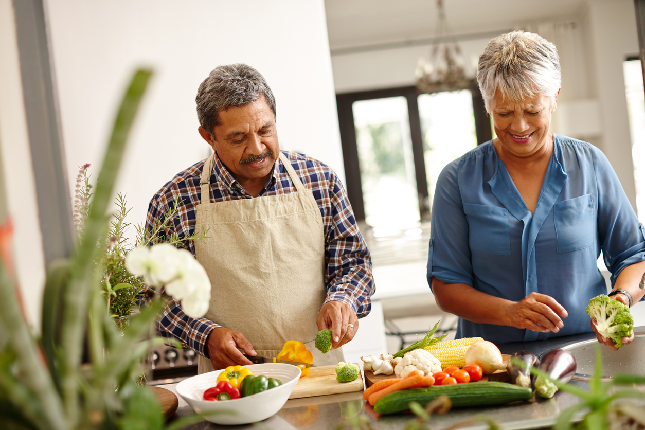 A Senior Couple Cooking a Healthy Meal Together in Bayside Senior weight loss diets in Bayside; a senior couple cooking a healthy meal together.