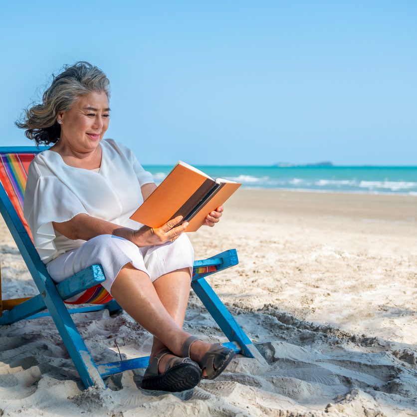 Elderly woman uses UV protection best practices.