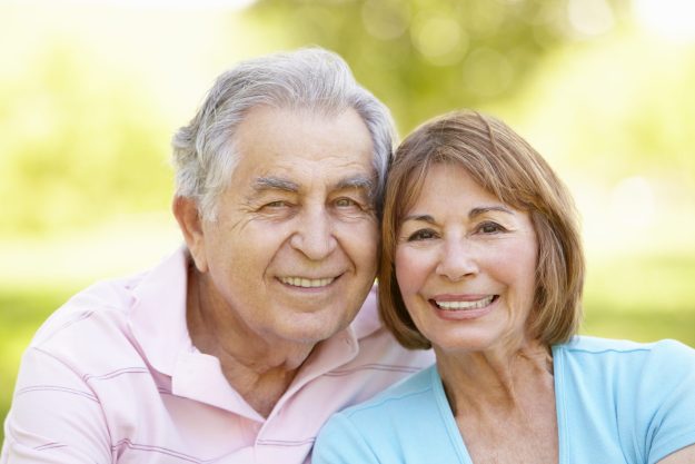 Senior Hispanic Couple Relaxing In Park Test your knowledge of long term care insurance.