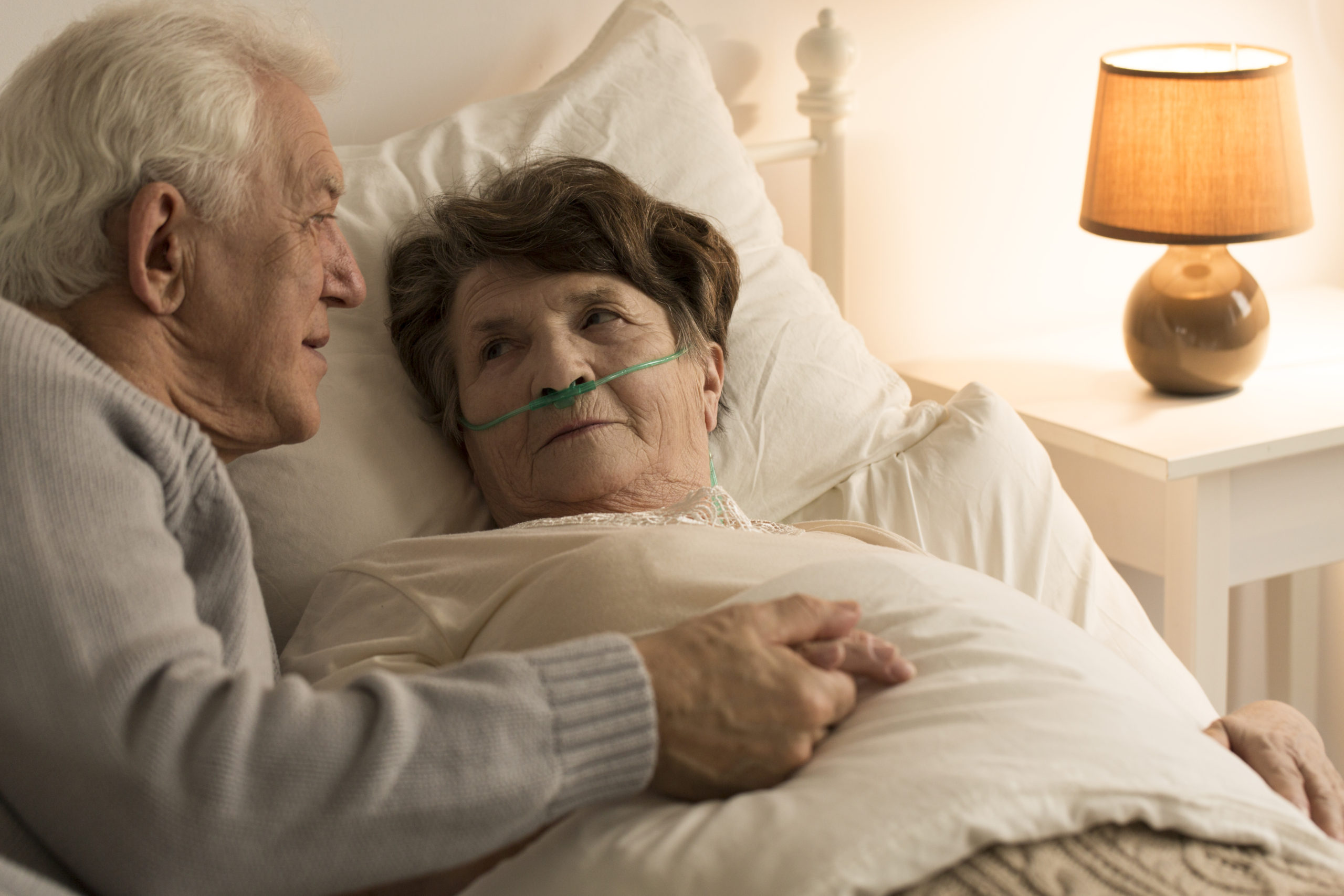 Man comforting sick wife hospice care and finding quality care